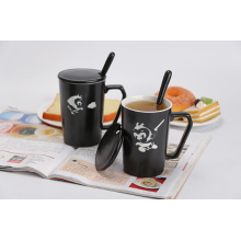 ceramic black coffee mug with spoon and lid